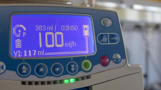 Fluid Drug Dripping via Infusion Pump in Hospital Room