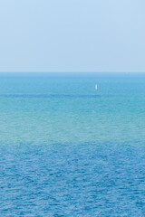Single or alone sailboat in the big sea.