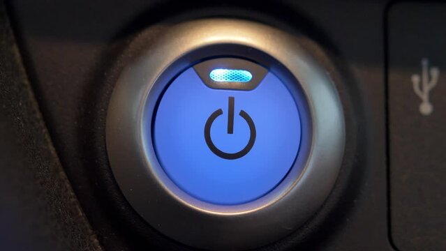 Pressing Stand By Power Button To Turn On and Off the Electric Car Close-Up