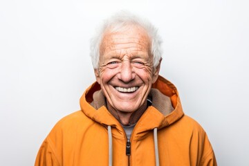Headshot portrait photography of a grinning old man wearing a cozy zip-up hoodie against a white background. With generative AI technology