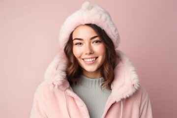 Obraz premium Medium shot portrait photography of a satisfied girl in her 20s wearing a cozy winter coat against a pastel or soft colors background. With generative AI technology