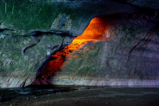 Bolii cave ( Pestera Bolii ), near Petrosani city, Hunedoara county, Romania. The cave is artificially illuminated and is open to visitors.