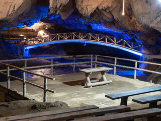 Bridge in Bolii cave ( Pestera Bolii ), near Petrosani city, Hunedoara county, Romania. The cave is artificially illuminated and is open to visitors.