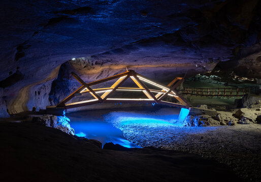 Bridge in Bolii cave ( Pestera Bolii ), near Petrosani city, Hunedoara county, Romania. The cave is artificially illuminated and is open to visitors.