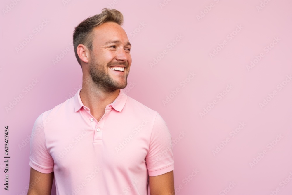 Canvas Prints Lifestyle portrait photography of a happy boy in his 30s wearing a sporty polo shirt against a pastel pink background. With generative AI technology