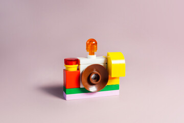blocks camera made of building blocks, isolated on white. Concept of work, photography, photographer, photo, picture, dslr, compact camera, mirrorless.