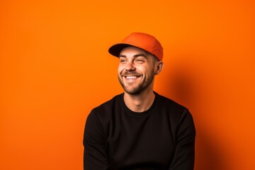 Lifestyle portrait photography of a satisfied boy in his 30s wearing a cool cap against a bright orange background. With generative AI technology