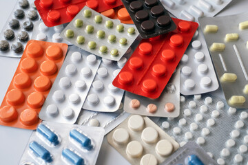 Pills background. Heap of assorted various medicine tablets and pills different colors. Health care. Top view