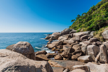 Coastline with amazing granite rocks and quiet ocean.