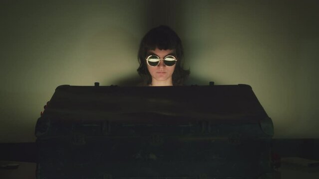 Girl opens a black suitcase containing golden glowing mysterious treasure. Movie-like cinematic scene. Hidden mystery concept. Spy, burglar, smuggler character. 80s vintage style.
