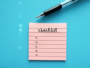 Pen on notepad writing CHECKLIST, means list of all things need to do or information to find out or things need to take somewhere