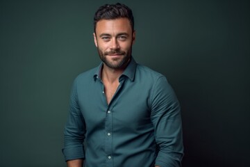 Fototapeta premium Close-up portrait photography of a glad boy in his 30s wearing an elegant long-sleeve shirt against a dark grey background. With generative AI technology