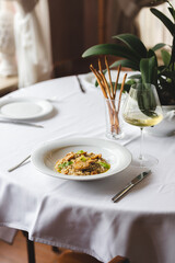 Stylish serving of food in the restaurant. Serving. Waiter