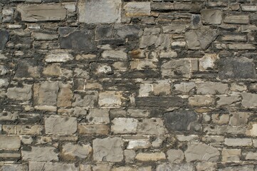 Background, wall fragment. Decorative wall made of natural stones.
