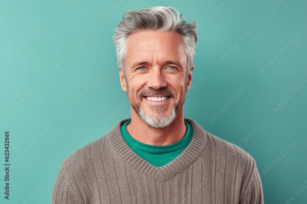 Wall mural Close-up portrait photography of a grinning mature man wearing a cozy sweater against a pastel green background. With generative AI technology - Wall murals