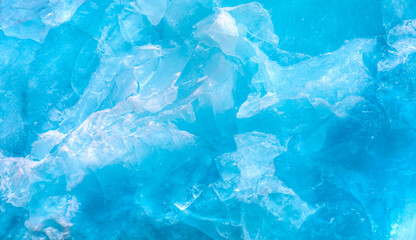 A close-up of the layered surface of a blue glacier (iceberg) - Knud Rasmussen Glacier near Kulusuk...