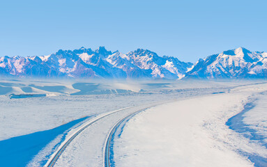 Beautiful Landscape with deep winter railway and snowy mountains