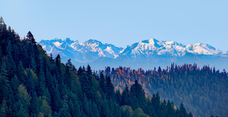 Beautiful landscape with cascade blue mountains at the morning - View of wilderness mountains during foggy weather © muratart