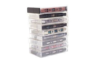 Stack of vintage audio cassettes isolated on white.