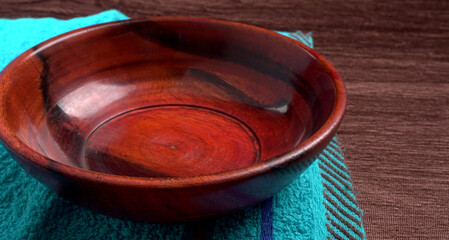  Empty wooden bowl and wooden spoon isolated with copy space.
