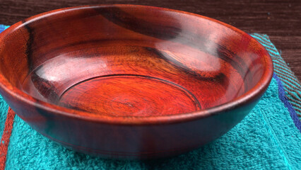  Empty wooden bowl and wooden spoon isolated with copy space.
