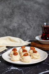 Almond and caramel cookies. Almond cookies on dark background