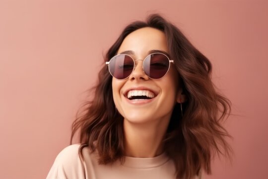 Medium shot portrait photography of a grinning girl in her 30s wearing a trendy sunglasses against a beige background. With generative AI technology