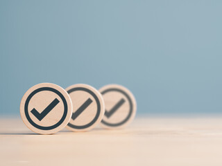 Checklist. Wooden label with tick mark icons for Task list, Survey, and assessment. Confirmation or...