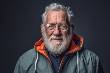 Photography in the style of pensive portraiture of a happy old man wearing a lightweight windbreaker against a cool gray background. With generative AI technology