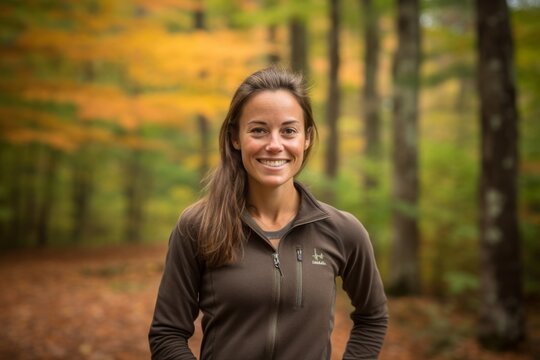 Environmental portrait photography of a happy girl in her 30s wearing a sporty polo shirt against an autumn foliage background. With generative AI technology
