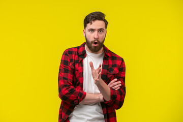 Man posing with surprised and worried face expression looking away from camera