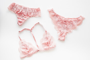 Elegant pink lace lingerie panties and bra for romantic gift, top view