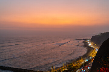 Orange Sunset in la Costa Verde (Green Coast) in Lima, Peru - 623464453