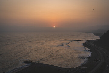 Orange Sunset in la Costa Verde (Green Coast) in Lima, Peru - 623464465