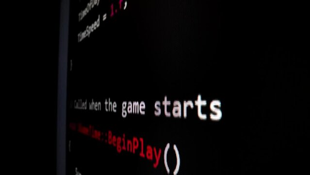 Closeup macro shot movement of coding script moving across LED screen with real-time AI-generated typing, showcasing advanced AI learning in optimization, debug and coding for software development.