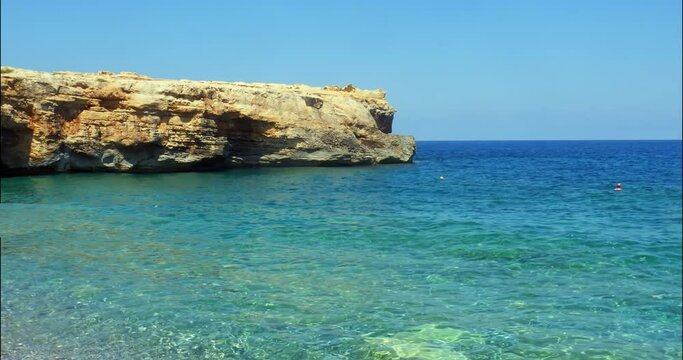 coastal rocks with natural sea caves near Spilies beach on Crete, Greece, Rethymno prefecture.