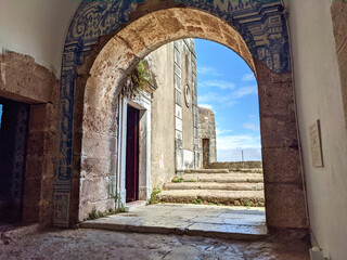 light coming through arch at Forte de S&atilde;o Filipe (historical fort in Portugal) staircase, door, ruins, doorway