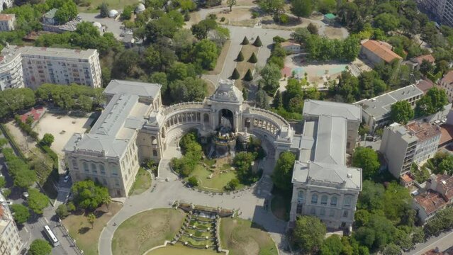 Aerial shot of the Palais Longchamp with its statues and fountains, in Marseille, France