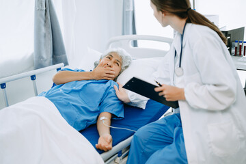 Fototapeta premium Woman Doctor and patient discussing something while sitting on examination bed in modern clinic or hospital . Medicine and health care concept.