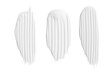 A set of different strokes of white cream on a blank background. PNG