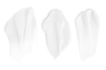 A set of different strokes of white cream on a blank background. PNG