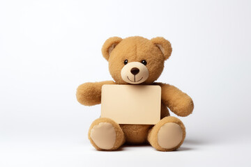 A teddy bear and a blank card for promotion