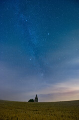 Middle european nightscape near an ancient watchtower. Milkyway, nightsky and stars