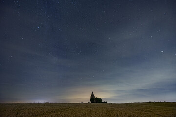 Middle european nightscape near an ancient watchtower. Milkyway, nightsky and stars