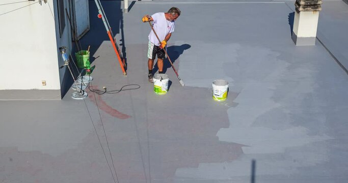 Waterproofing Of Roof. Worker Cover Roof With Resin. Timelapse View On Construction Work