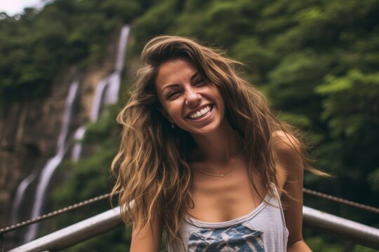 Medium shot portrait photography of a grinning girl in her 30s wearing a cute crop top against a majestic waterfall background. With generative AI technology