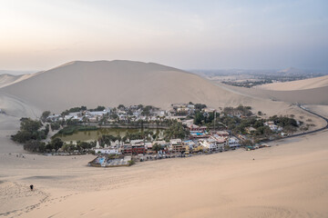 Views of the Huacachina oasis during the sunset in Ica, Peru - 623483204