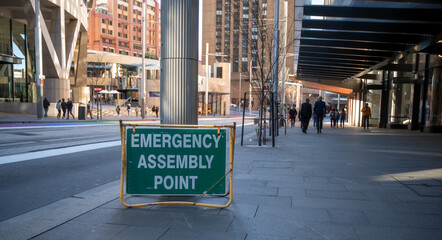 emergency assembly point sign on street side in the city Sydney Australia