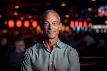 Obraz premium Three-quarter studio portrait photography of a tender mature man wearing a classy button-up shirt against a lively concert venue background. With generative AI technology
