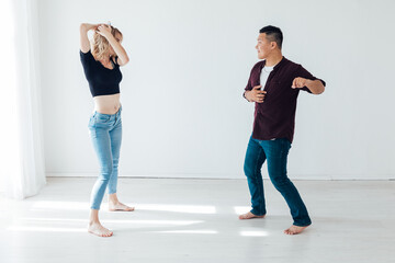 bachata Latina man and woman dancing in the hall of kizomba studio